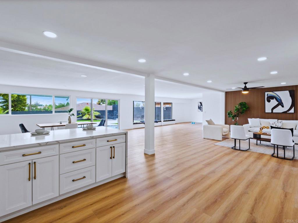 1894 Wedgemere Road El Cajon, CA 92020 - Photo 10 of 60 a kitchen with stainless steel appliances granite countertop a lot of counter space and wooden floors