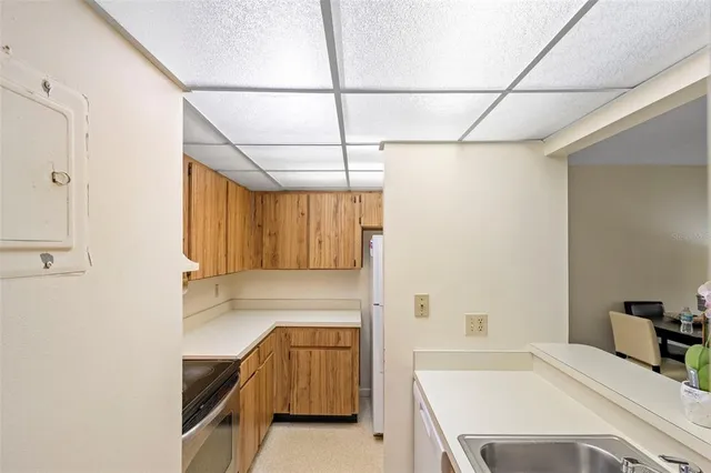 a kitchen with a stove and a refrigerator
