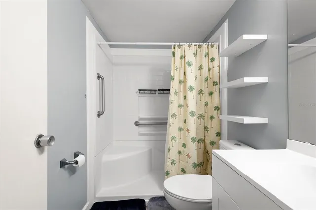 a bedroom with a bed and table