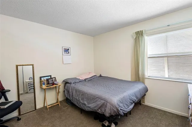 a bathroom with a sink toilet and shower curtain