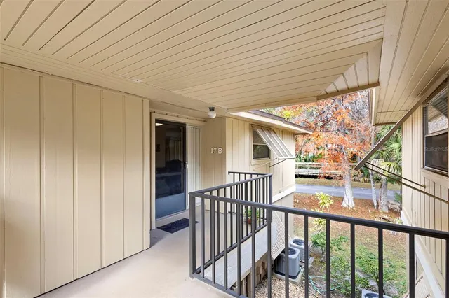 a view of a porch with wooden floor and stairs
