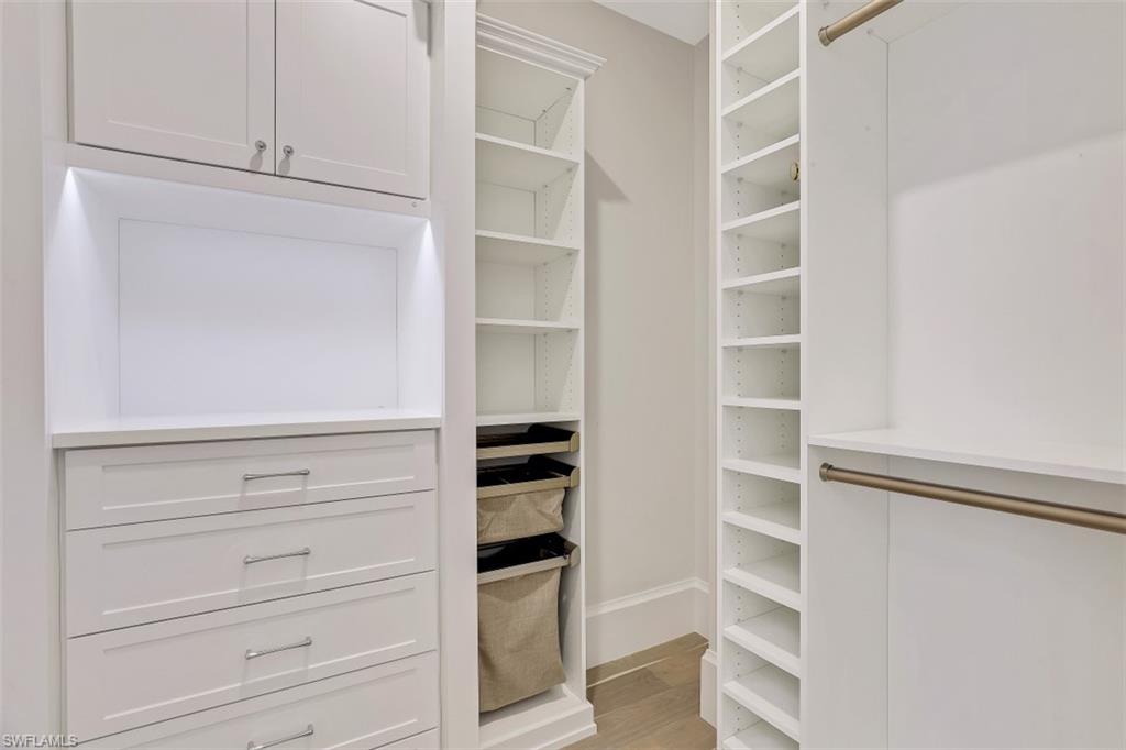 650 Wedge Drive Naples, FL 34103 - Photo 20 of 34 a view of walk in closet with empty racks
