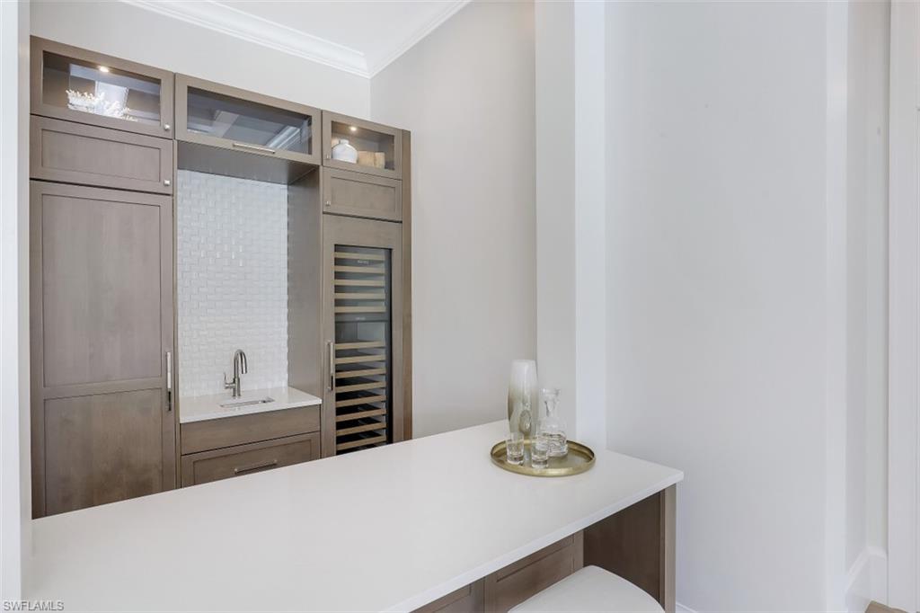 650 Wedge Drive Naples, FL 34103 - Photo 21 of 34 a dining room with furniture and wooden floor