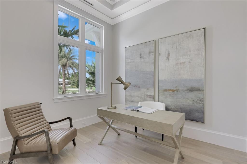 650 Wedge Drive Naples, FL 34103 - Photo 26 of 34 a view of a workspace with furniture and a window