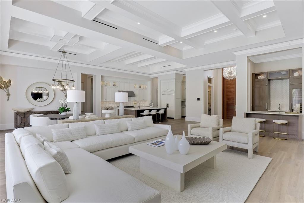 650 Wedge Drive Naples, FL 34103 - Photo 3 of 34 a living room with furniture and a mirror