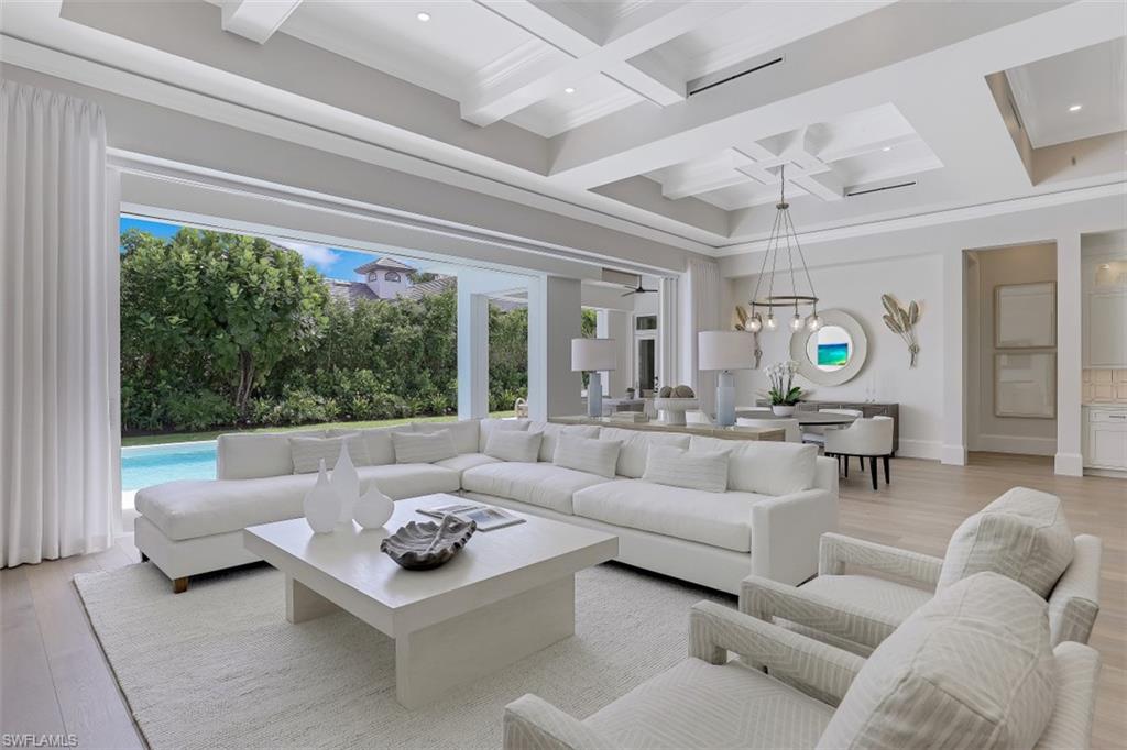 650 Wedge Drive Naples, FL 34103 - Photo 5 of 34 a living room with furniture and a large window