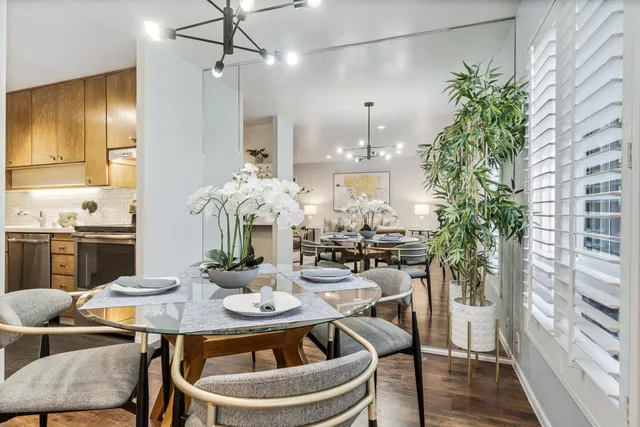 a view of a dining room with furniture window and wooden floor