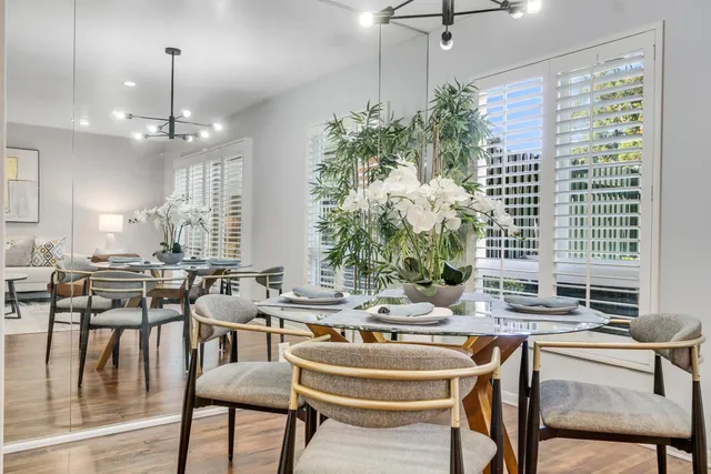 a dining room with furniture and window