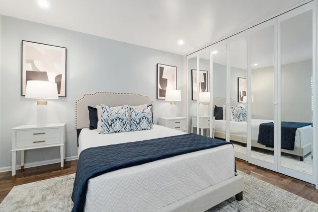 a bedroom with a large bed and furniture