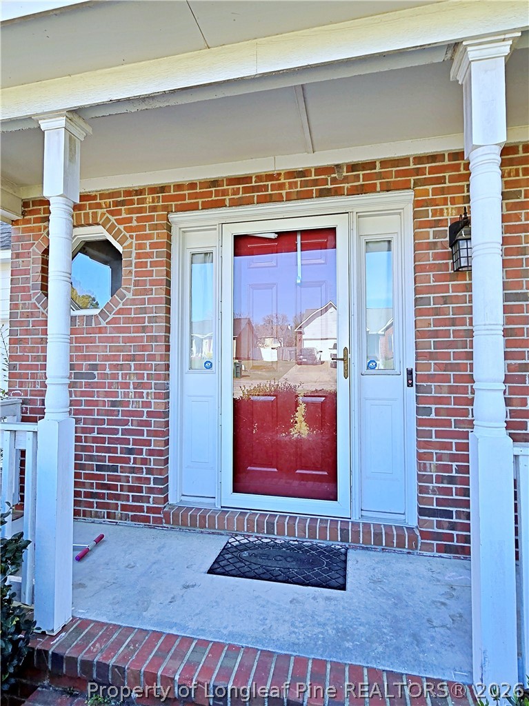 5218 Pringle Way Hope Mills, NC 28348 - Photo 2 of 43 a view of a wooden door of the house