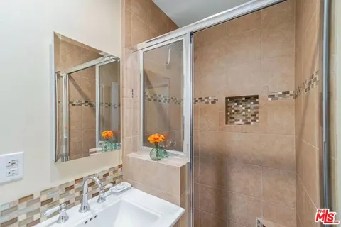 a bathroom with a sink and a mirror