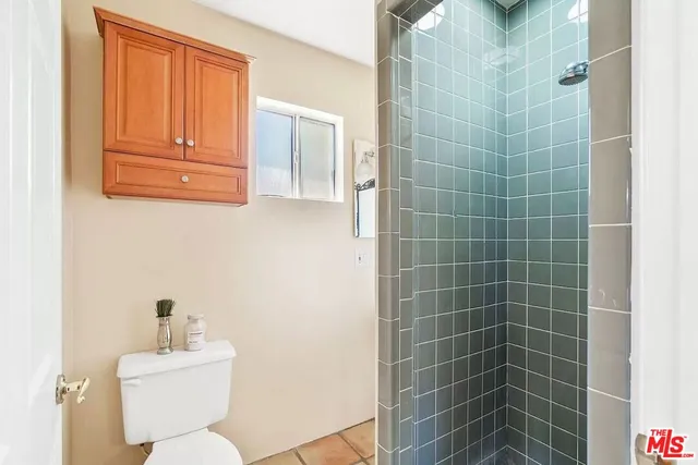 a bathroom with a sink mirror and toilet