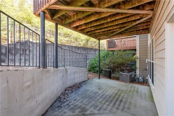 a view of a backyard with a wooden fence