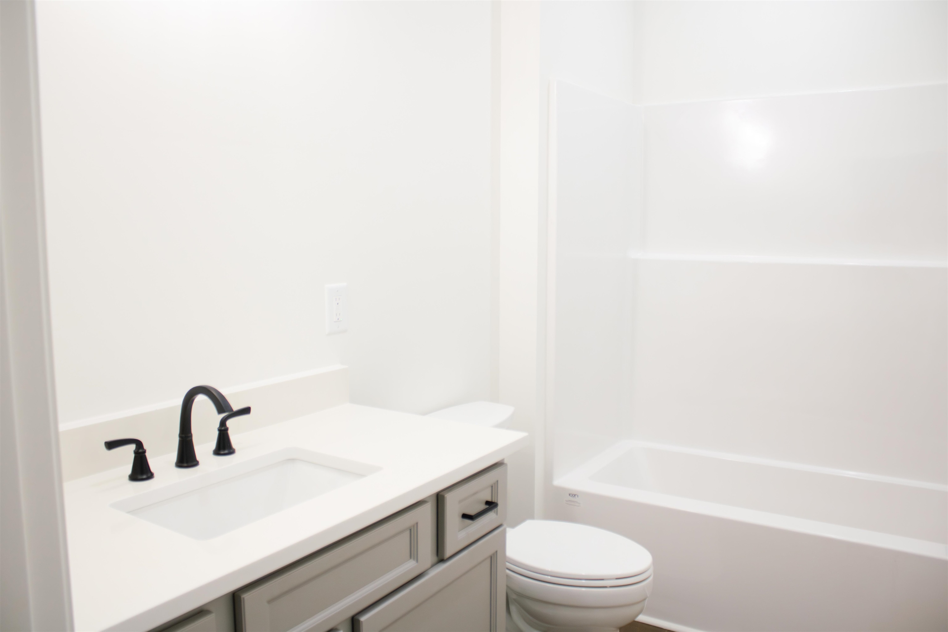 261 Oakgrove Road Selmer, TN 38375 - Photo 8 of 15 a bathroom with a sink a toilet and a bathtub