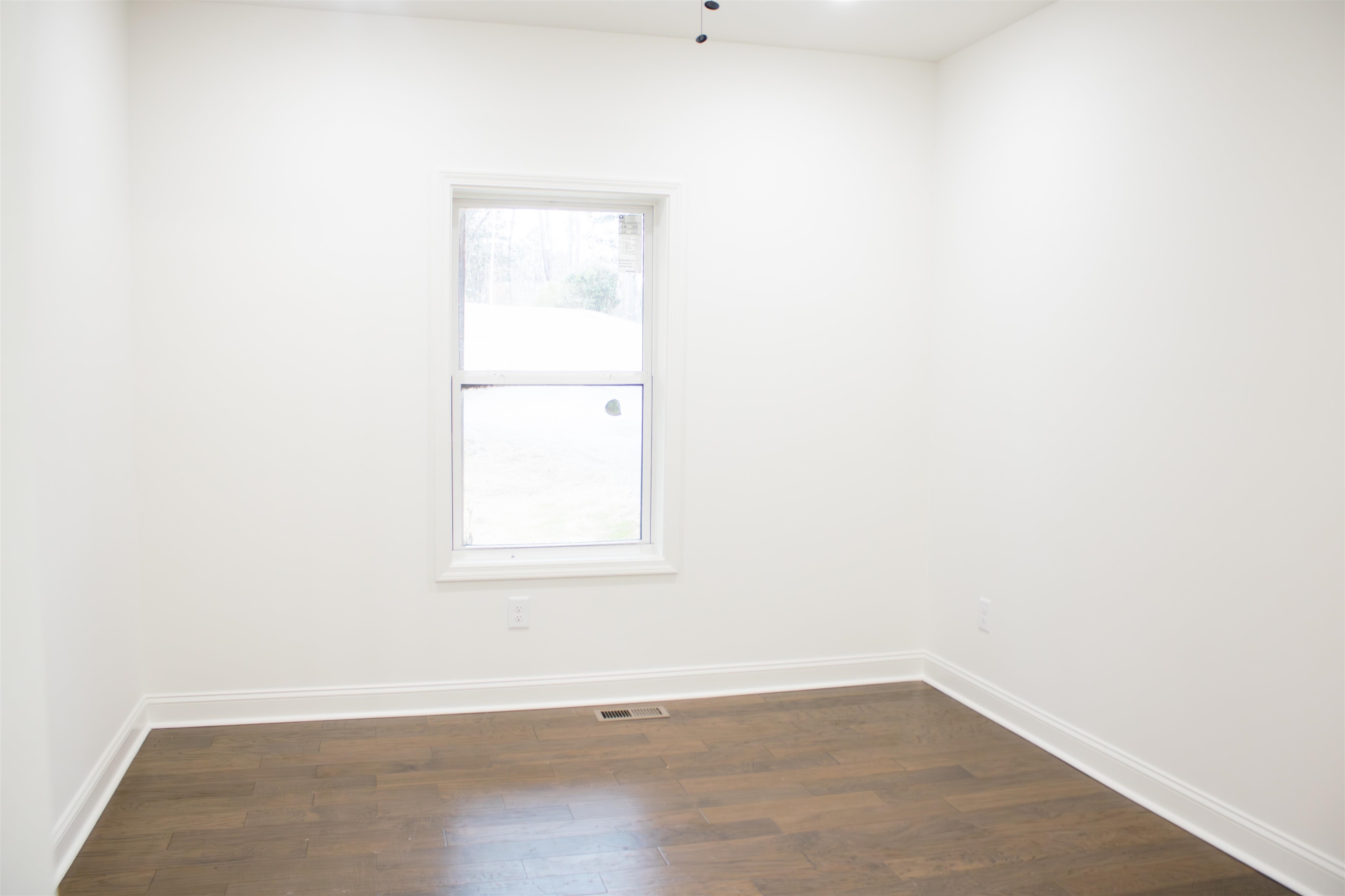 261 Oakgrove Road Selmer, TN 38375 - Photo 9 of 15 an empty room with a window