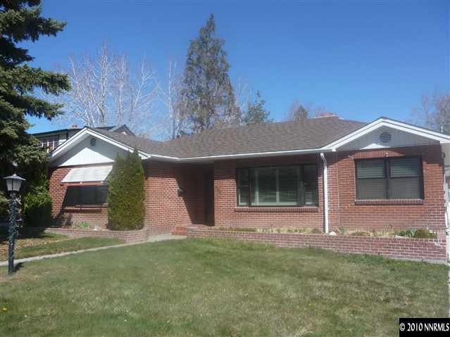 1135 Mt Rose Street Reno, NV 89509 - Photo 1 of 7 a front view of a house with garden