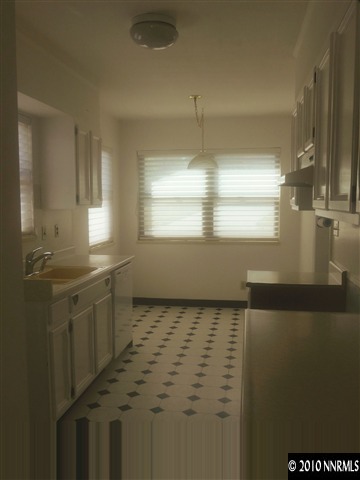 1135 Mt Rose Street Reno, NV 89509 - Photo 4 of 7 a bathroom with a sink a vanity and a mirror