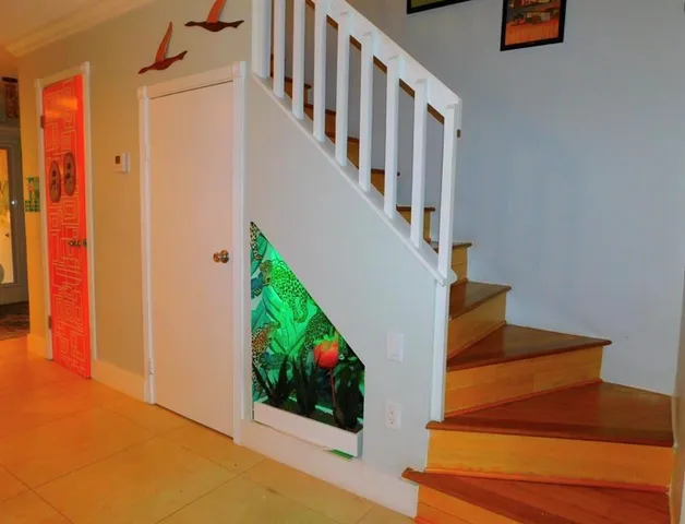 a view of entryway and hall with wooden floor