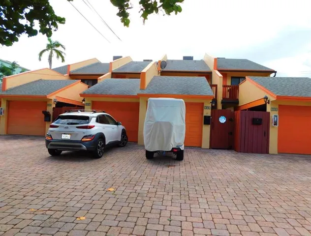 a car parked in front of a house