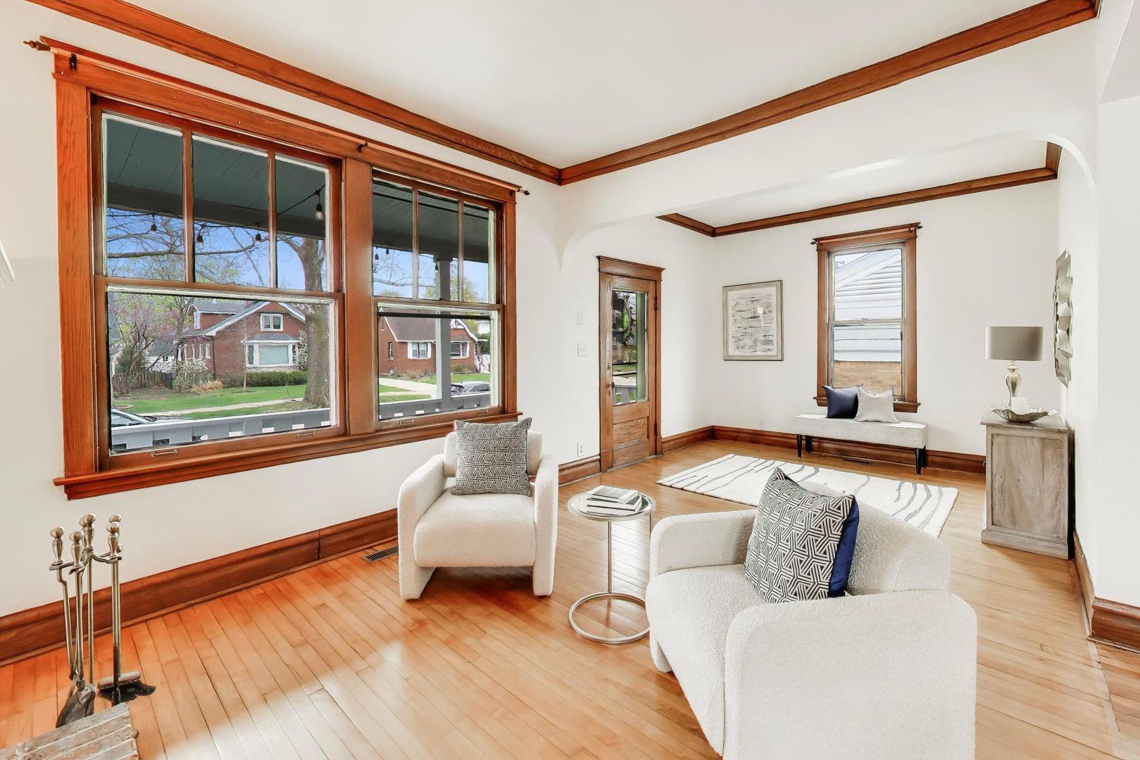 256 Blackhawk Road Riverside, IL 60546 - Photo 7 of 73 a living room with furniture and a large window