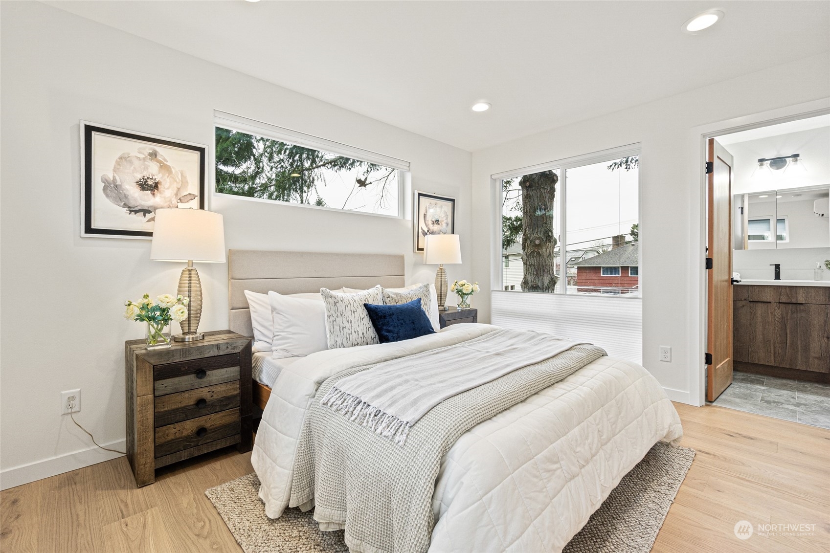 4256 33rd Avenue West Seattle, WA 98199 - Photo 15 of 24 a bedroom with a bed and a view of kitchen