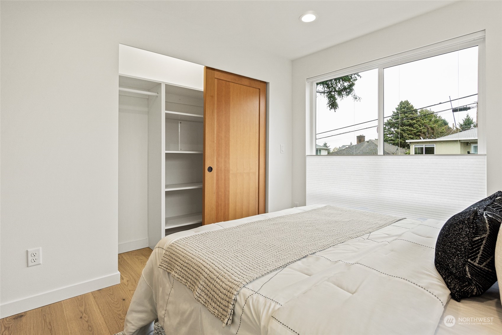 4256 33rd Avenue West Seattle, WA 98199 - Photo 18 of 24 a bedroom with a bed and a large window
