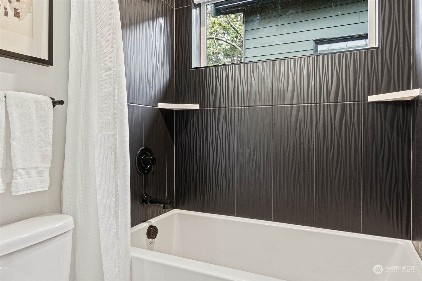 4256 33rd Avenue West Seattle, WA 98199 - Photo 23 of 24 a bathroom with a bathtub