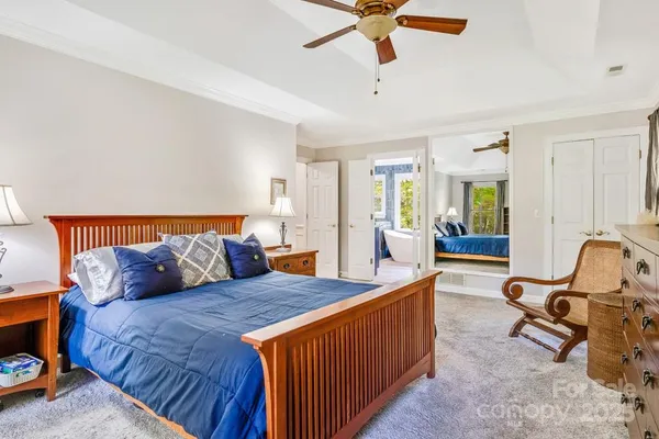 a bed room with a bed and a chair