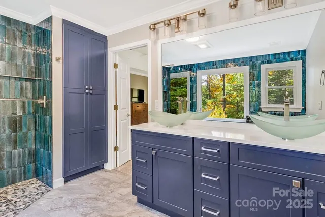 a kitchen with a sink and a large window