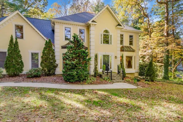 a front view of a house with garden