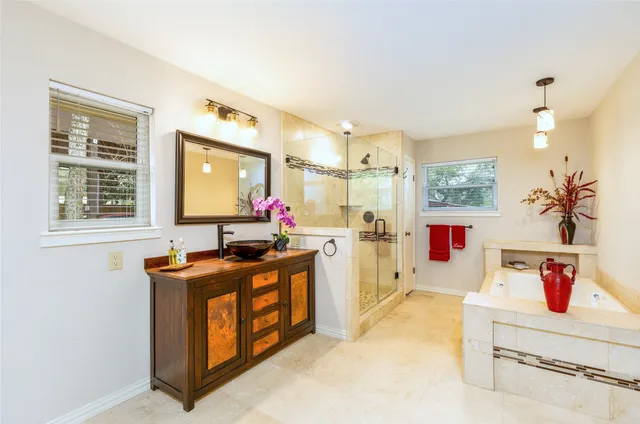 a kitchen with stainless steel appliances granite countertop a stove and a sink
