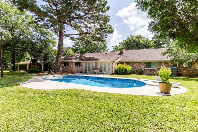 a front view of a house with swimming pool