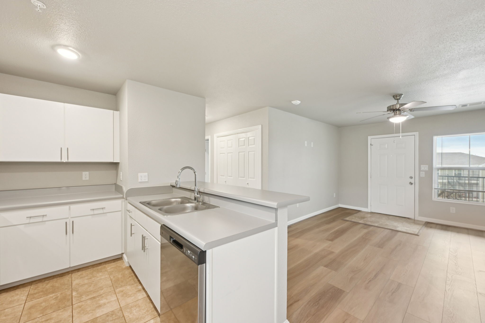 254 Plez Morgan Drive, Unit F Montgomery, TX 77356 - Photo 14 of 31 a kitchen with a sink cabinets and window
