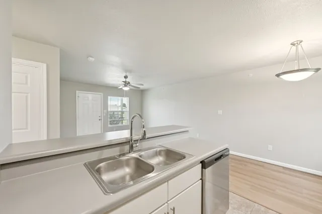a kitchen with a sink and a window