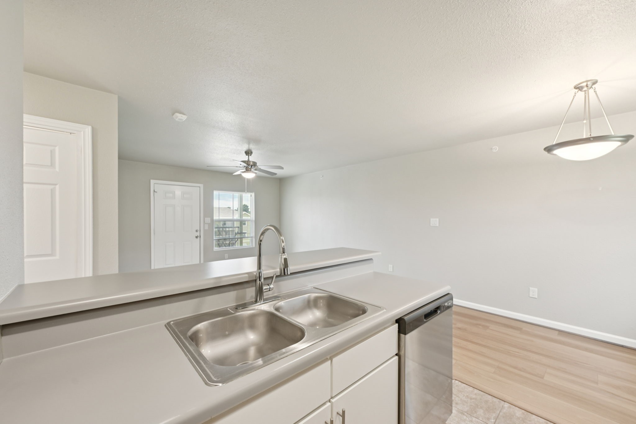 254 Plez Morgan Drive, Unit F Montgomery, TX 77356 - Photo 15 of 31 a kitchen with a sink and a window