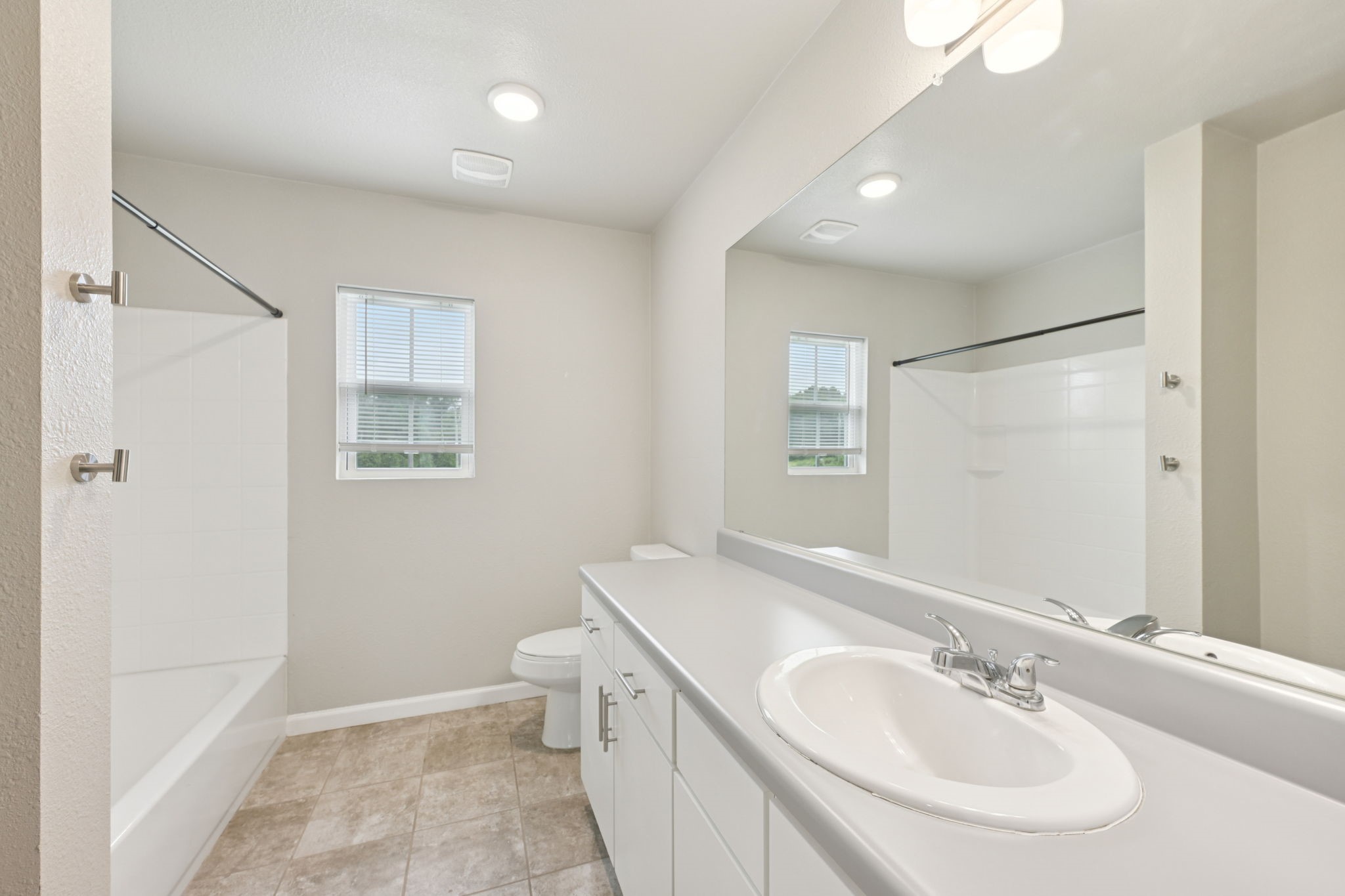 254 Plez Morgan Drive, Unit F Montgomery, TX 77356 - Photo 21 of 31 a bathroom with a sink a toilet and shower