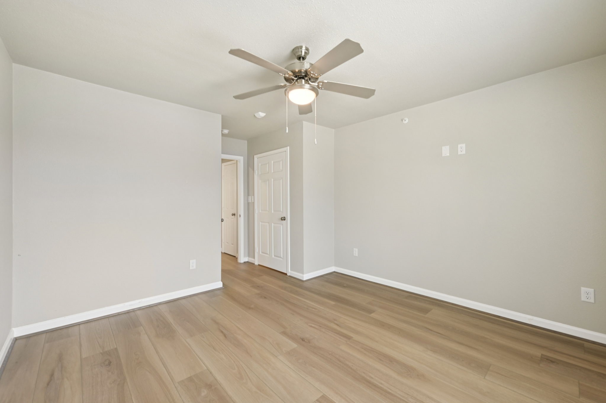 254 Plez Morgan Drive, Unit F Montgomery, TX 77356 - Photo 26 of 31 wooden floor in an empty room