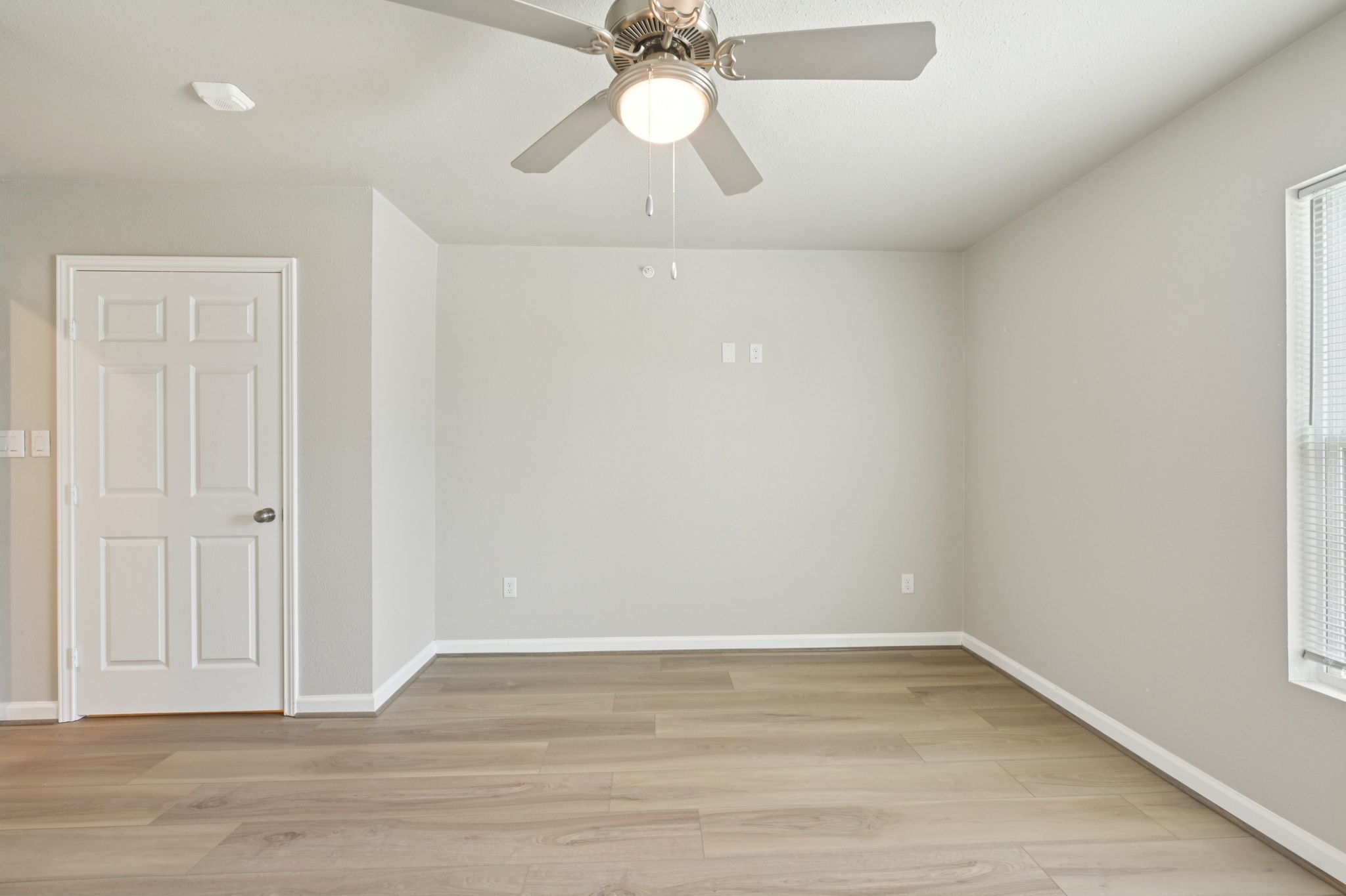 254 Plez Morgan Drive, Unit F Montgomery, TX 77356 - Photo 28 of 31 wooden floor in an empty room