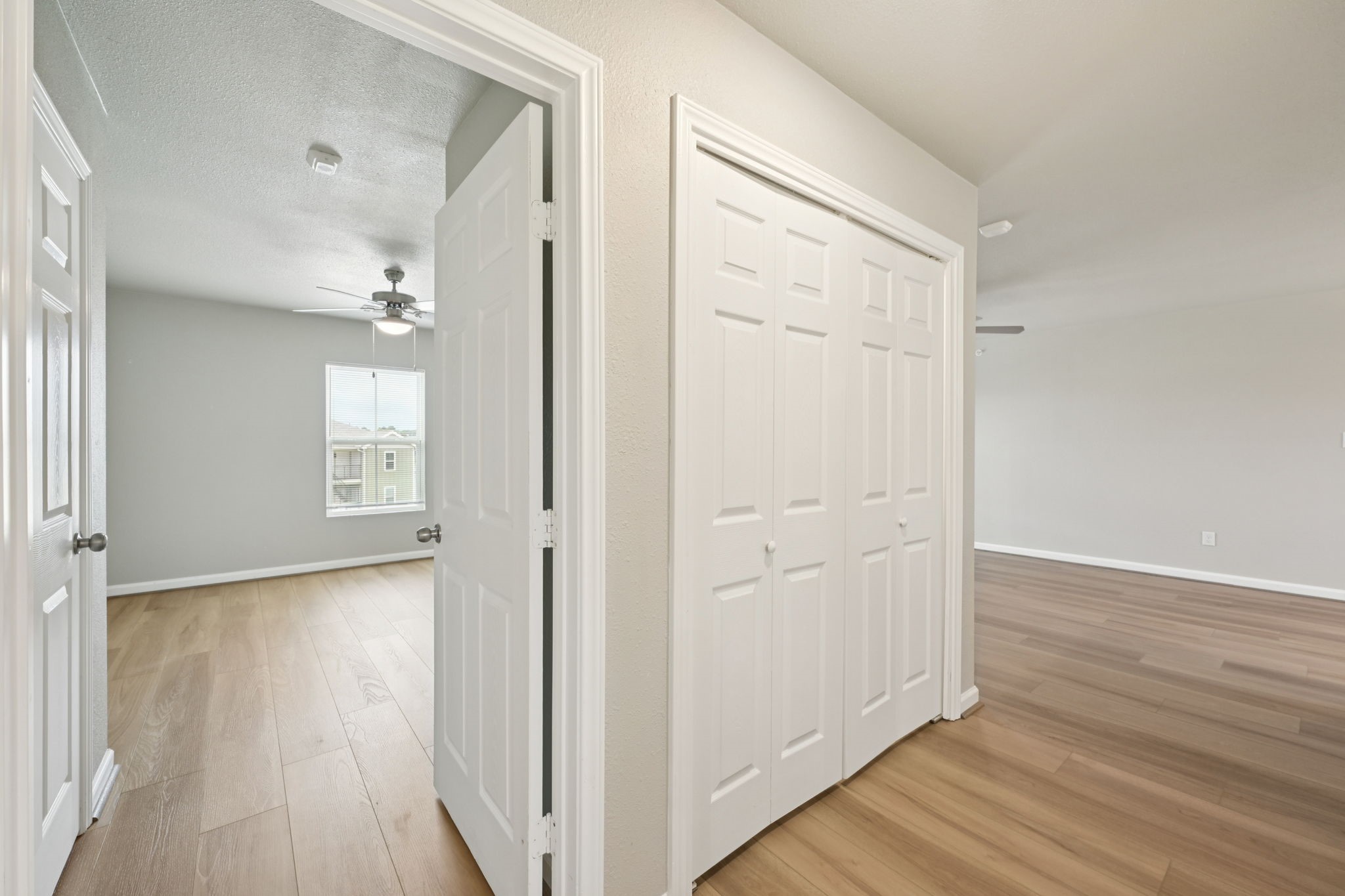 254 Plez Morgan Drive, Unit F Montgomery, TX 77356 - Photo 30 of 31 a view of a hallway with wooden floor