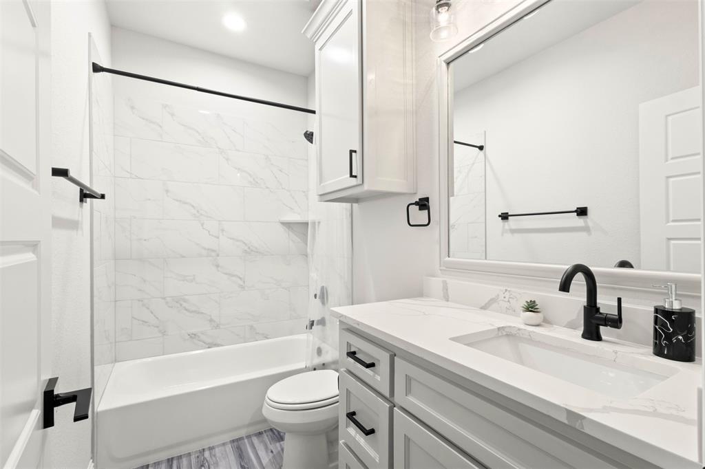 105 Clayton Crossing Springtown, TX 76082 - Photo 23 of 40 a bathroom with a sink toilet and shower