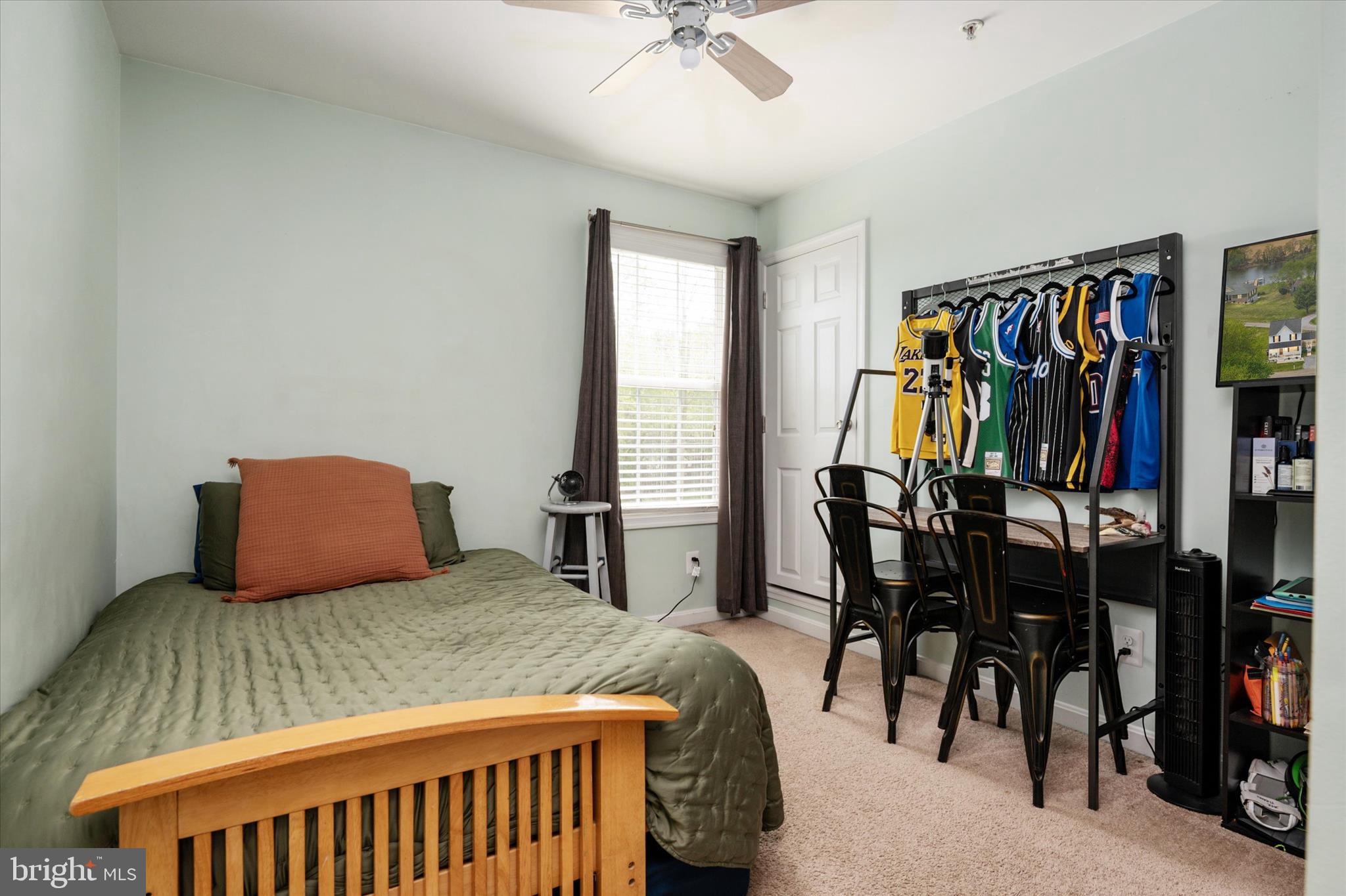 200 Newtown Road Chester, MD 21619 - Photo 26 of 50 a bedroom with a bed and a chandelier