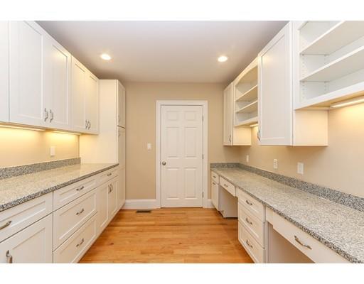 46 Colburn Street Westwood, MA 02090 - Photo 13 of 30 a kitchen with granite countertop white cabinets and white appliances