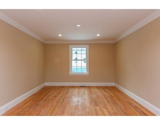 46 Colburn Street Westwood, MA 02090 - Photo 14 of 30 a view of an empty room with wooden floor and a window