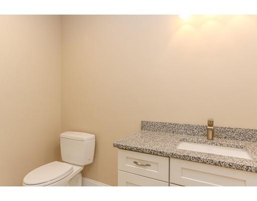 46 Colburn Street Westwood, MA 02090 - Photo 15 of 30 a bathroom with a granite countertop toilet and a sink