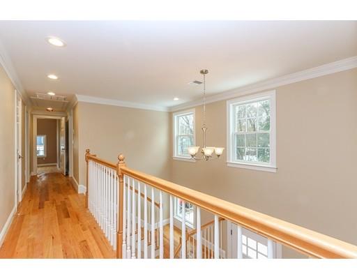 46 Colburn Street Westwood, MA 02090 - Photo 16 of 30 a view of a hallway with wooden floor and windows