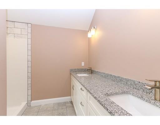46 Colburn Street Westwood, MA 02090 - Photo 19 of 30 a bathroom with a granite countertop sink and a mirror