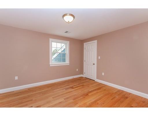 46 Colburn Street Westwood, MA 02090 - Photo 20 of 30 a view of an empty room with wooden floor and a window