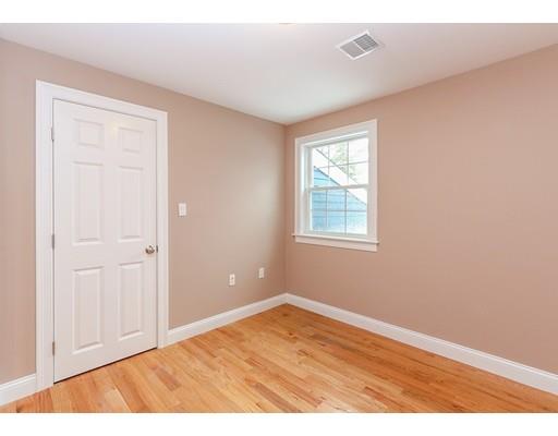 46 Colburn Street Westwood, MA 02090 - Photo 24 of 30 a view of an empty room with wooden floor and a window