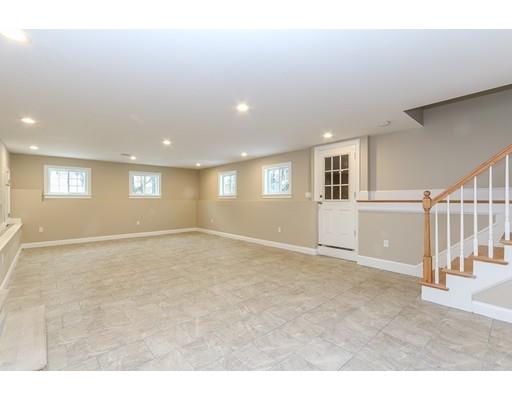 46 Colburn Street Westwood, MA 02090 - Photo 26 of 30 a view of an empty room with wooden floor and a window