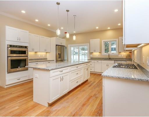 46 Colburn Street Westwood, MA 02090 - Photo 7 of 30 a large kitchen with granite countertop a large stove top oven and cabinets